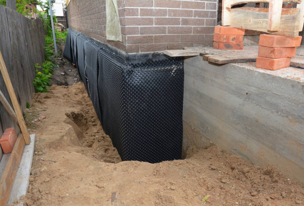 SJ Waterproofing Pros technician performing targeted Waterproofing assessment in East Lansing, MI